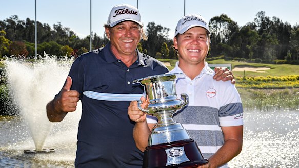 Unlikely duo: Jake McLeod (right) with volunteer caddie John Sandak.