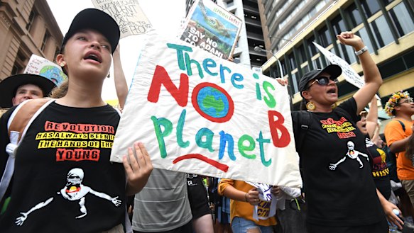 School students take part in the climate change strike in Brisbane.