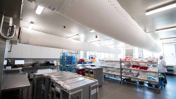 Inside the cold kitchen where meals are finished and loaded into airplane trays. 