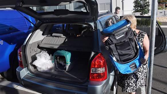 A resident leaves Opal Tower on Christmas morning.