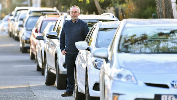 Chris Appleby on the street outside his home.