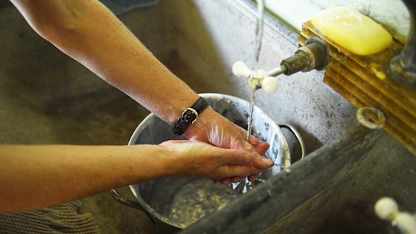 O'Mara and her husband collect water from hand washing in the laundry to put on the plants.