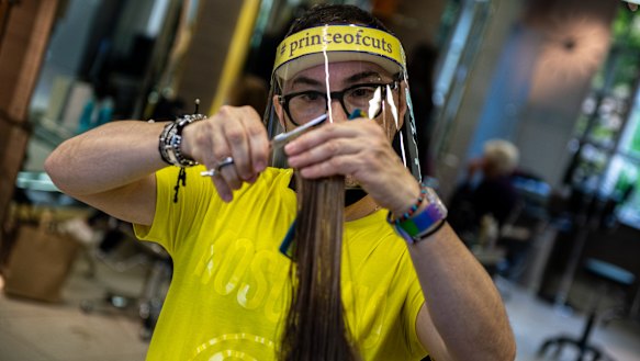 Hair stylist Cristiano Basciu takes the necessary precautions to get back to work after the salon was closed for over three months due to the pandemic.