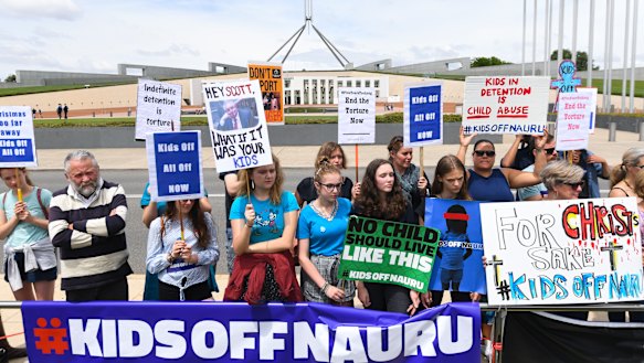 Protesters outside Parliament House call for the resettlement of children held on Nauru. 