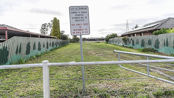 A block on Denton Ave where a house was demolished and never rebuilt.