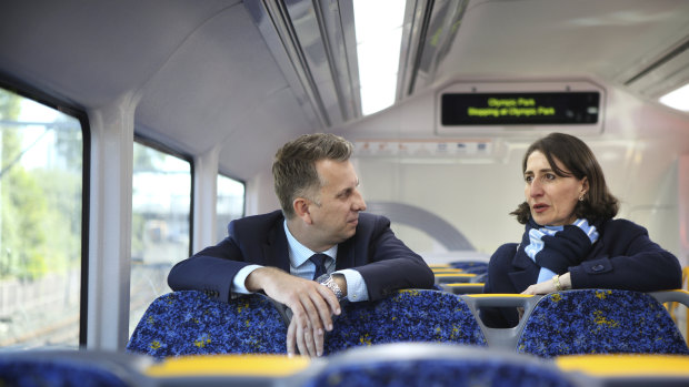 Transport Minister Andrew Constance and Premier Gladys Berejiklian aboard a new Waratah train in Sydney in 2018.