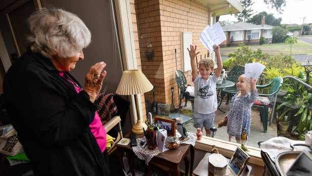 Willow Fedke (3) and Leo Fedke (6) are writing letters to their elderly neighbours. Here they are with 86-year-old Maureen.