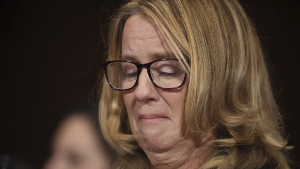 Christine Blasey Ford holds back tears as she testifies to the US Senate about an alleged assault by Supreme Court nominee Brett Kavanaugh.