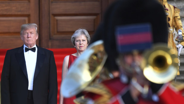 Theresa May stands with US President Donald Trump, left, arrive for a black-tie dinner at Blenheim Palace, west of London, in July.  Trump's first visit to the UK. 