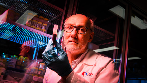 Professor Peter holds a vial of blood. His work usually focuses on strokes, not cancer.