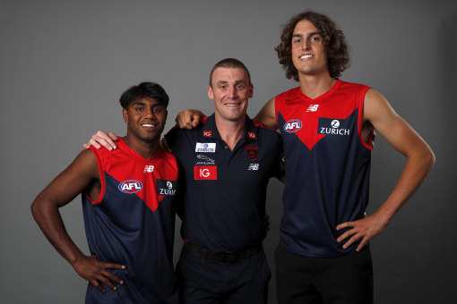 Melbourne coach Simon Goodwin with Kysaiah Pickett (left) and Luke Jackson in their draft year of 2019.