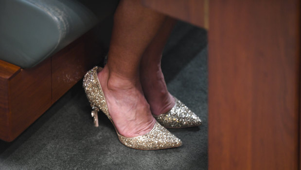 Former Australian Foreign Minister Julie Bishop's shoes are seen on the floor of the House of Representatives during a motion to suspend standing orders calling for government intervention for the dairy industry at Parliament House in Canberra, Thursday, February 21.