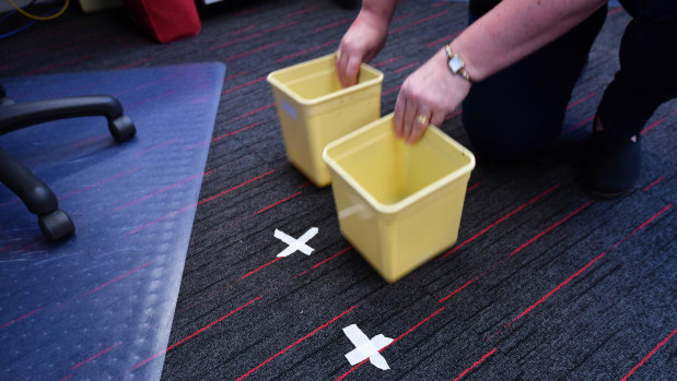 X marks the spot. Masking tape reveals where buckets need to be positioned when it rains