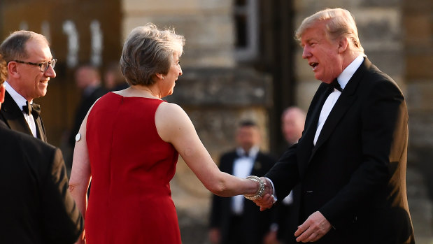 Theresa May greets Donald Trump at Blenheim Palace.