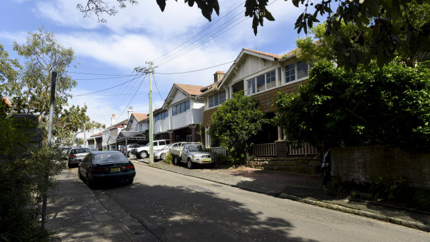 The couple's house, right, and their late neighbour's two properties on the left.