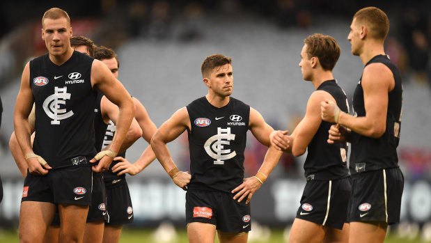 Marc Murphy with Carlton teammates after their crushing loss to Melbourne on the weekend.