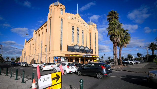 People queue for testing at the Palais Theatre in St Kilda, in Melbourne’s inner south.