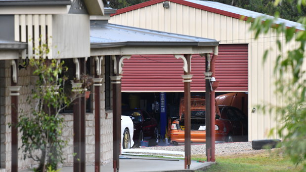 A shed is seen behind a house in the suburb of Buccan, south of Brisbane, where police were looking for the missing teen.