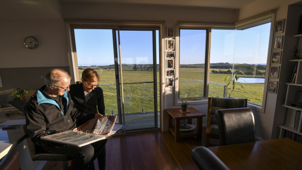 Retired couple Robert Newall and wife Karen in front of the farmland at Ventnor, Phillip Island, which had been rezoned by the former Planning Minister Matthew Guy.