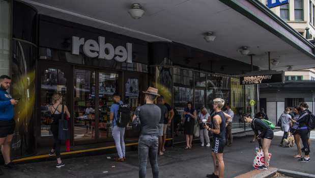 People queues outside Rebel Sport as they wait to buy gym equipment as Sydney closes down. 