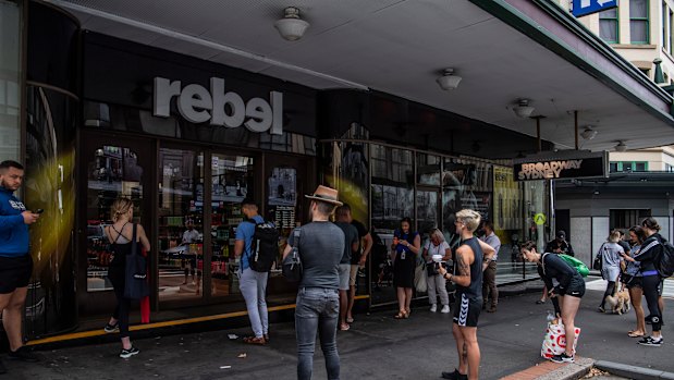 People queues outside Rebel Sport as they wait to buy gym equipment as Sydney closes down. 