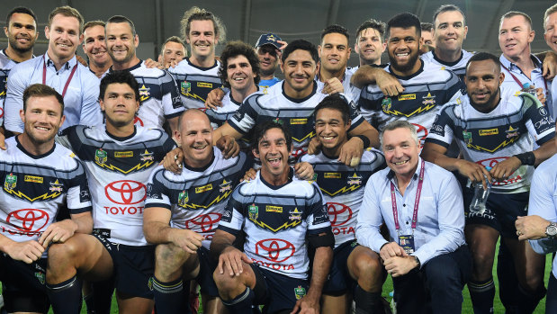 Unforgettable: Johnathan Thurston poses in a memorial photo with Cowboys teammates and coach Paul Green after the final whistle.