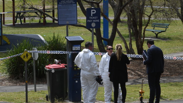 Detectives at Buffalo Creek Reserve, where a woman's body was found on Wednesday morning.