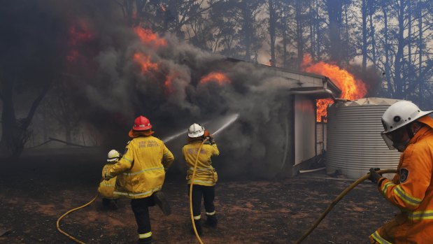 A local fire crew were "burnt over" as they tried to save a home in Bundanoon on Thursday.