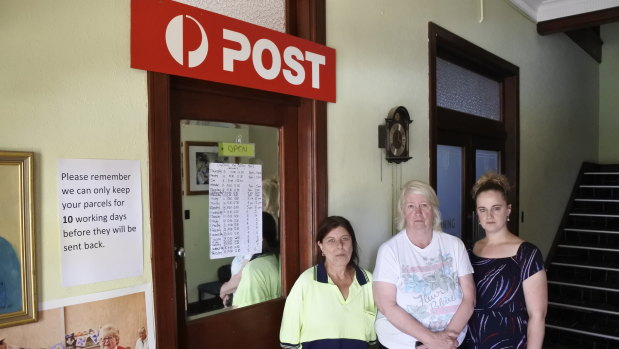 Post office worker Jo Lawrence, left, and locals Trish Stone and Claire Hooker, who are worried the Captains Flat post office will close at the end of February.