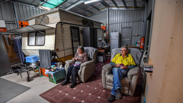 Lyn and Allan Wallwork inside the shed they are living in.