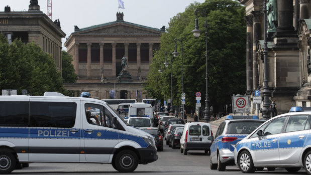 Police vehicles stand in front of Berlin Cathedral after the attack.