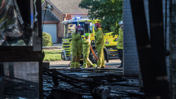 Firefighters at the scene of the fire at Olive in Mawson.