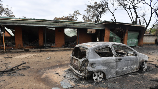 A house and car damaged by a bushfire that swept through Balmoral in the NSW Southern Highlands on Saturday.