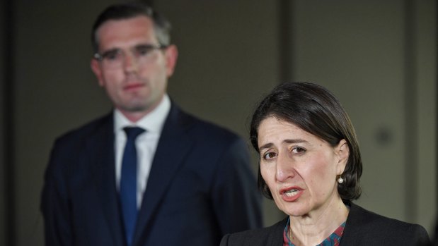 Gladys Berejiklian and Dominic Perrottet announcing a one year freeze on public service pay rises on Wednesday.