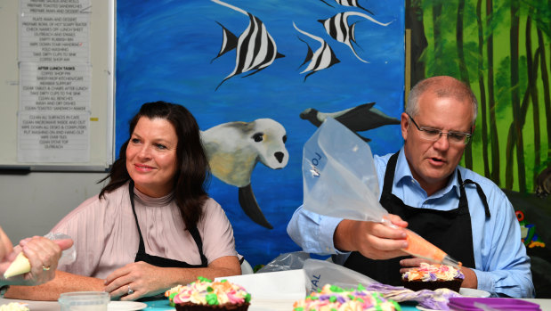 Jenny and Scott Morrison decorating cakes on the election trail. 