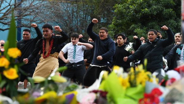 Students from Victoria University Secondary College perform a traditional dance at the service.