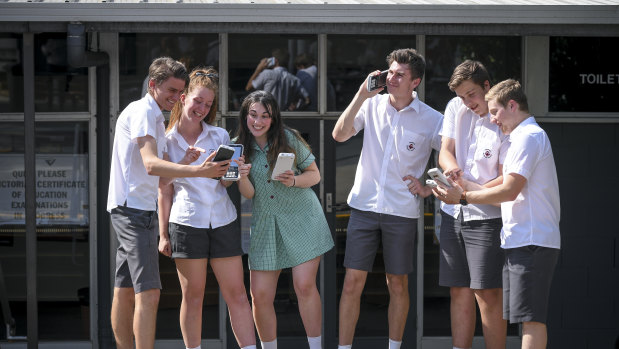 VCE students at Ringwood Secondary College joking after the stress of their maths exam.