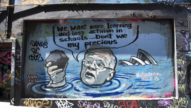 A mural in Melbourne depicting Prime Minister Scott Morrison in a flooded Sydney Harbour holding a lump of coal.