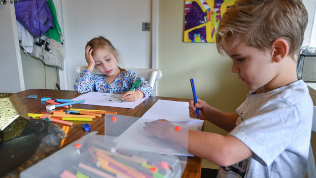 Willow Fedke (3) and Leo Fedke (6) are writing letters to their elderly neighbours.