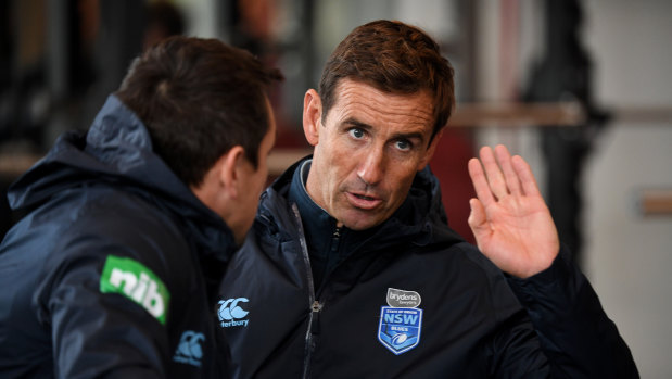 Helping hand: Andrew Johns talks tactics with Mitchell Pearce at Blues training on Thursday.