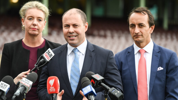 Bridget McKenzie, Josh Frydenberg and Dave Sharma during an announcement at the Sydney Cricket Ground.
