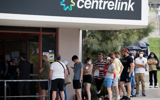 JobKeeper was introduced at the height of the coronavirus pandemic as people losing their jobs queued outside Centrelink.