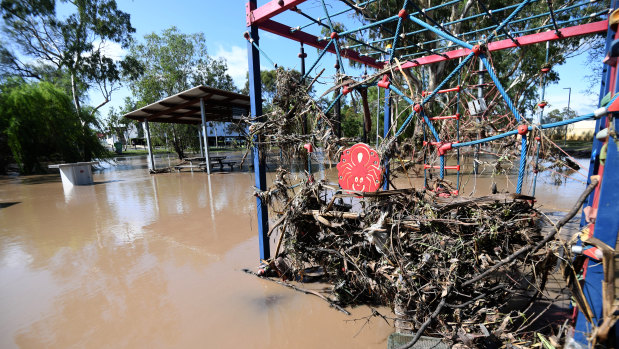 Playground equipment covered in debris  as floodwaters recede in Dalby.