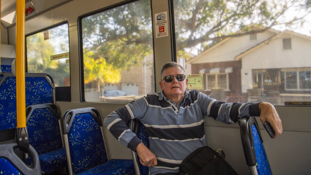 Breakfast Point retiree Michael Ward tries an on-demand bus for the first time.