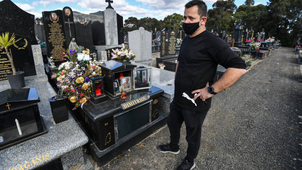Spiros Dimitriou at his father John’s grave, at the Northern Memorial Park in Glenroy. John died after acquiring a coronavirus infection at St Basil's after living there for almost three years.