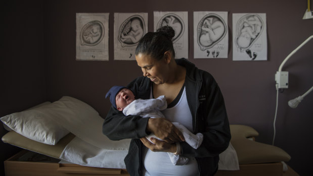 Stacey Foster-Rampant with her baby boy, Tyler, at a Malabar Community Midwifery Link Service clinic.