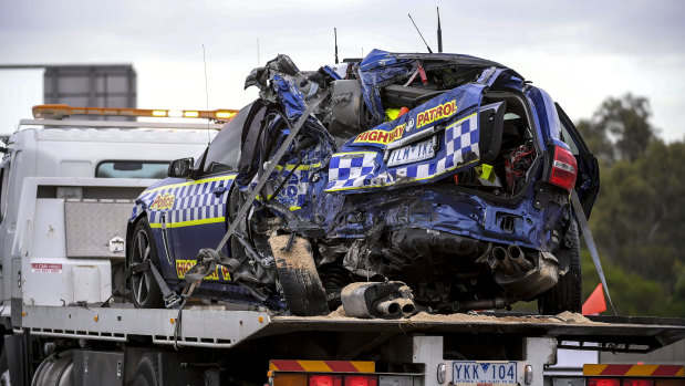 A police vehicle is removed from the scene of the crash in Kew in April 2020.