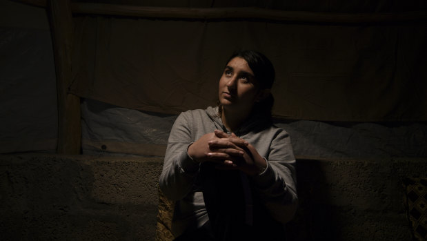 Ilham Dakhel Ali, 18, sits in the shelter she shares with her mother and youngest brother in Khanke IDP camp in Dohuk Governate of Iraqi Kurdistan. 