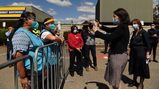 Premier Gladys Berejiklian thanks healthcare workers at the vaccination hub on Friday.