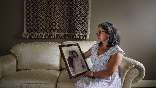 Lorena Bestrin holds a picture of herself and her son Amaru, who died of a heroin overdose in Liverpool Hospital in December 2016.